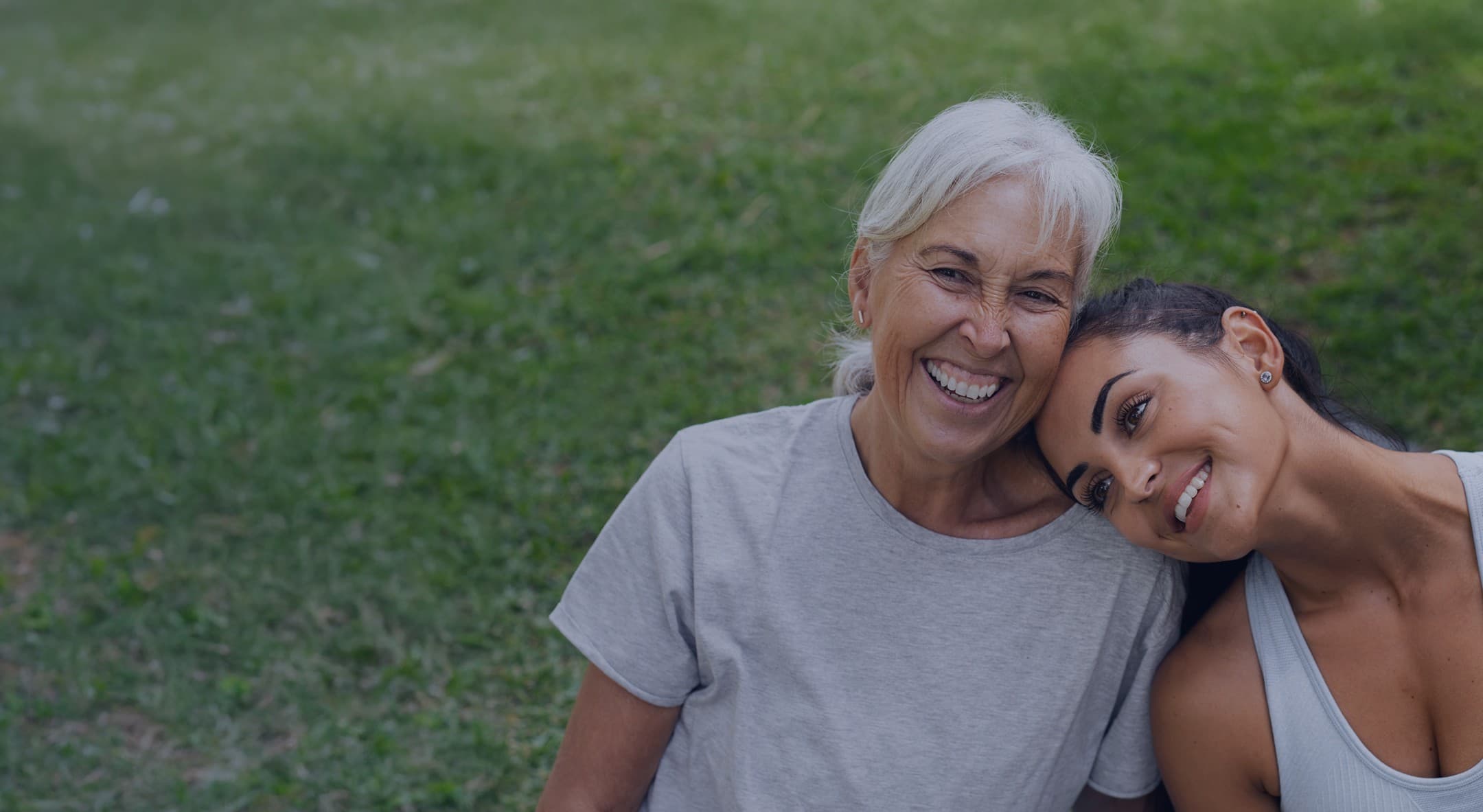 A mother and daughter embracing outdoors, representing restored balance and wellbeing