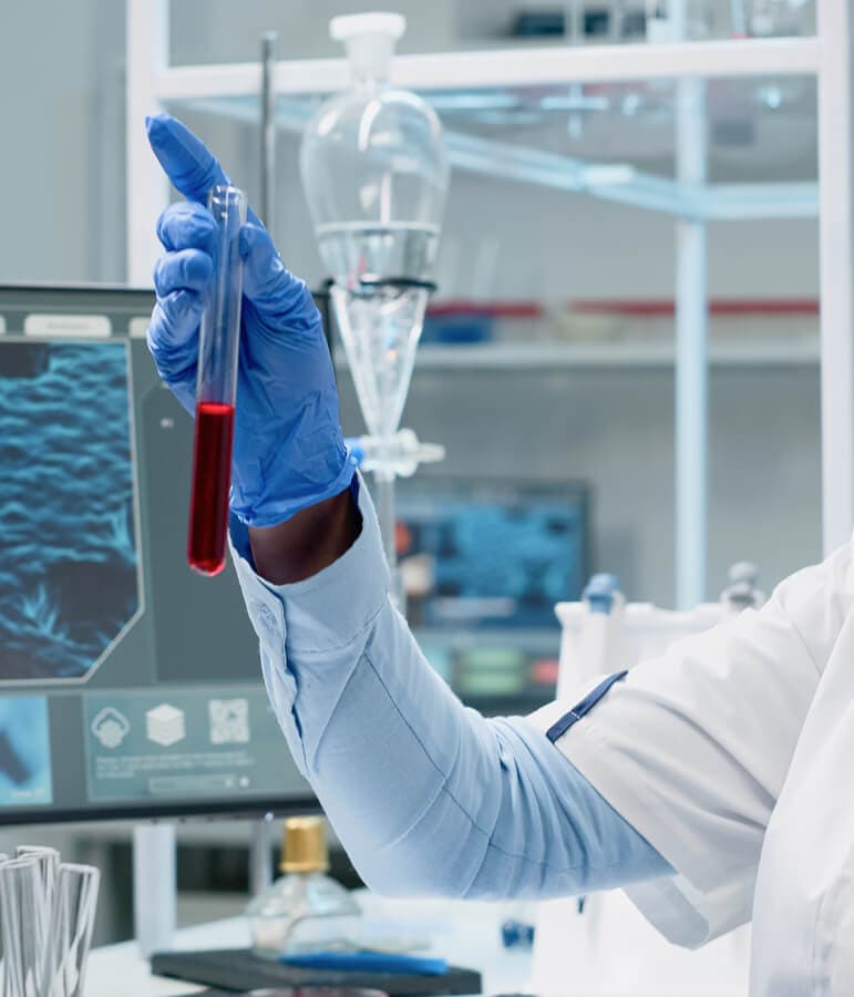 A clinician holding a blood sample for lab testing