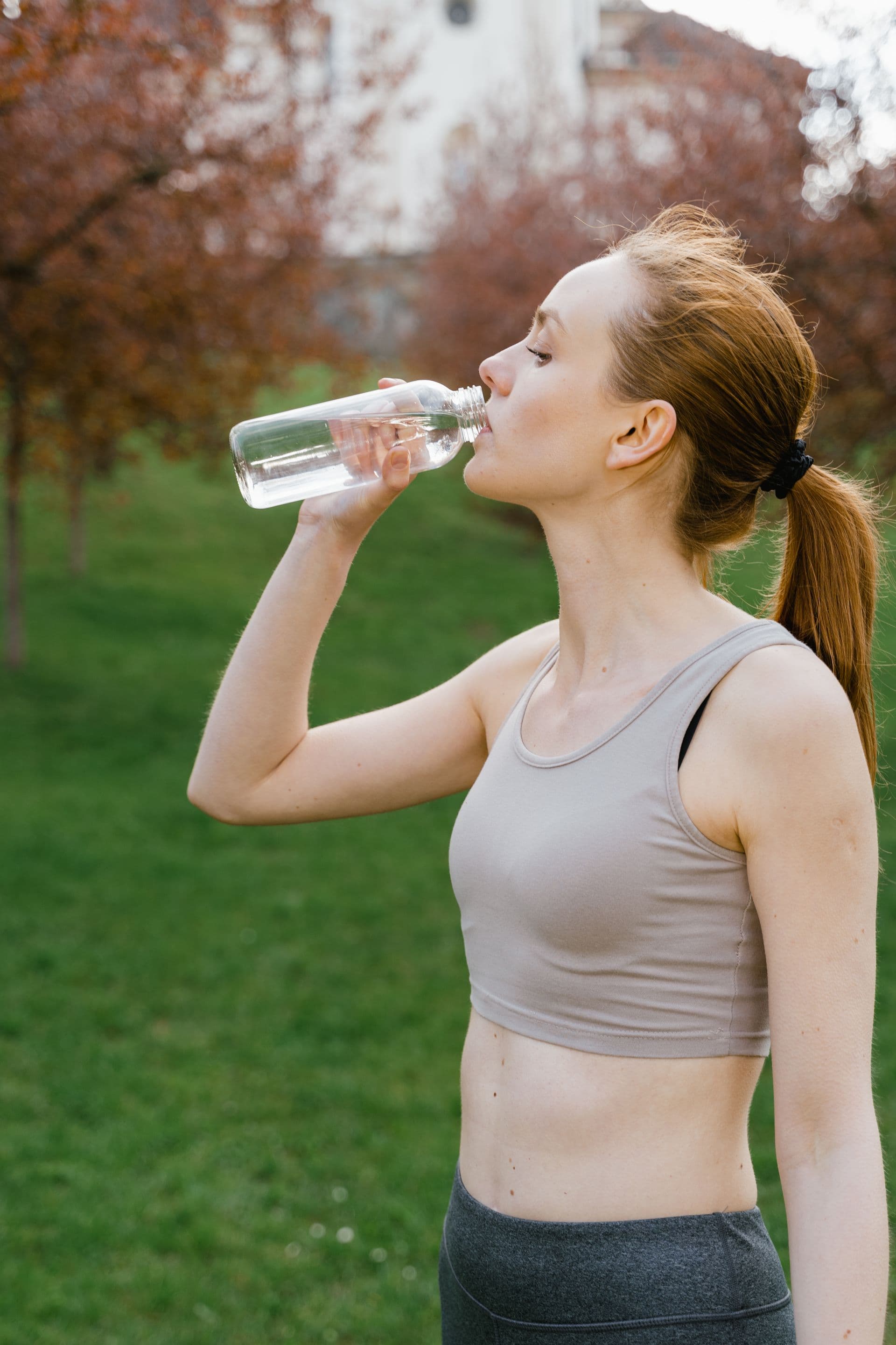 An active woman staying hydrated outdoors