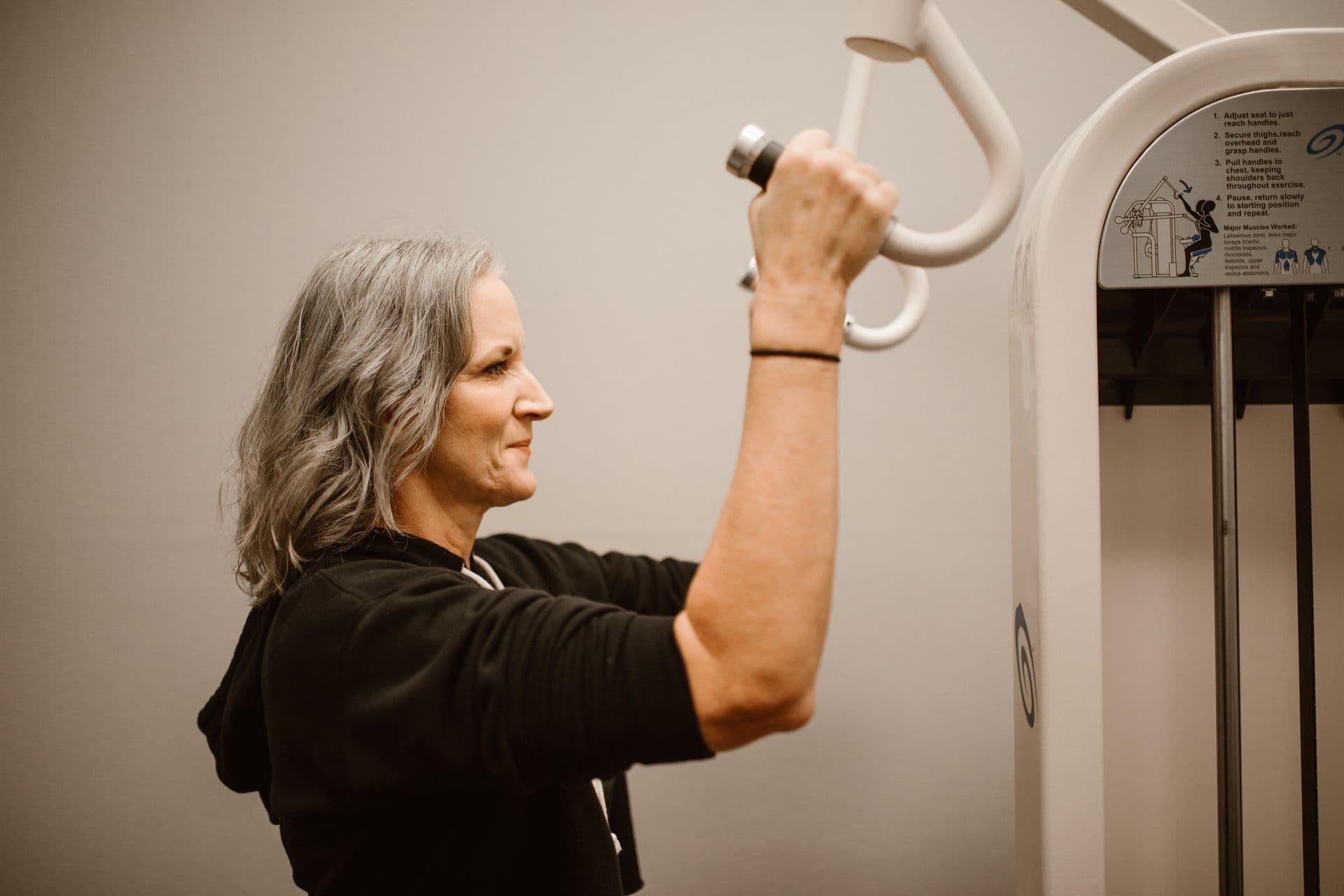 An active mature woman, strength training