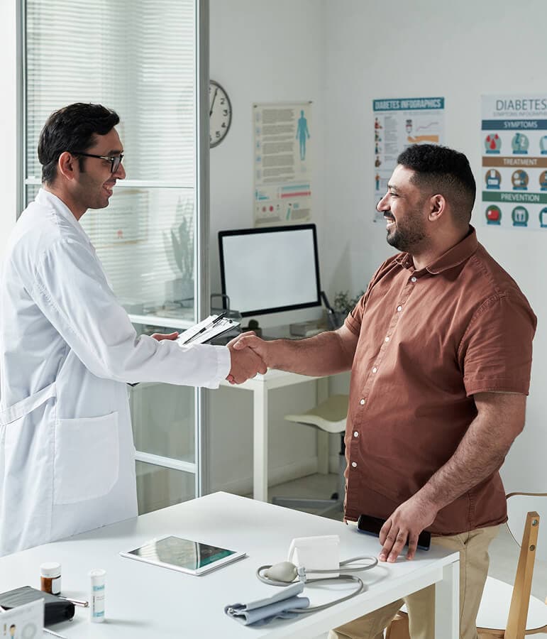 A physician greeting a patient during a weight loss consultation